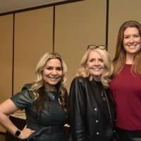 Three alumni posing for a picture.